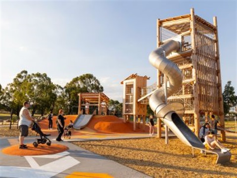 Parents with children playing on slides at Whittlesea Public Gardens