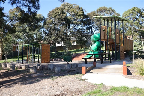 Park with play equipment and a picnic table