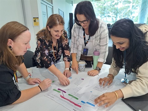 Children and Families Department meeting around a table.jpg