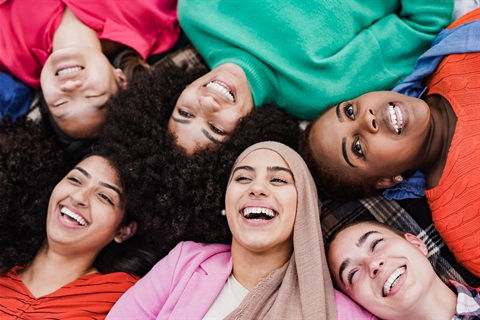 Joyful faces, intertwined in a circle of shared happiness.